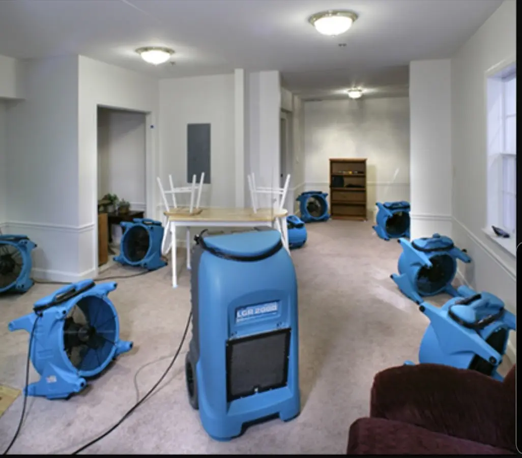 Air movers and dehumidifier setup for Water Damage Restoration in Santa Fe
